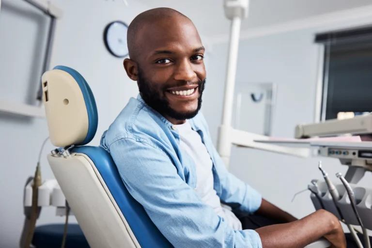 Man with a great smile sitting in the orthodontic treatment chair